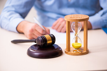 gavel and wedding rings and hourglass