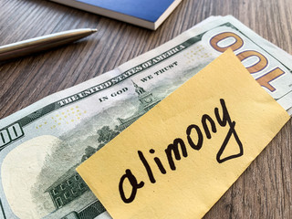 money and paper that says alimony