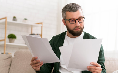 man holding papers