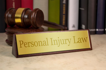 gavel and plaque that says personal injury law
