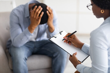 man with ptsd head in hands