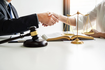 client and lawyer shaking hands