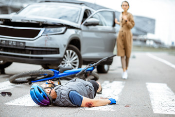 man on bike hit by car