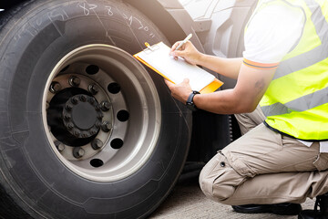 truck tire being checked